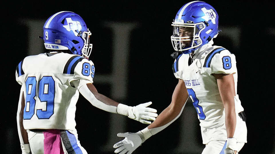 Barbers Hill wide receiver Landon Smith (8) celebrates his touchdown with wide receiver Kaegan Morton during the first half of a high school football game against Kingwood Park, Friday, Oct. 20, 2023, in Humble.