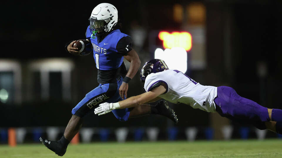 Episcopal Knights' Brandon Thomas (1) runs past the Kinkaid Falcons defender during the high school football game between the Episcopal Knights and the Kinkaid Falcons at Simmons Field in Bellaire, TX on Friday October 20, 2023. Episcopal defeated Kinkaid 42-35.