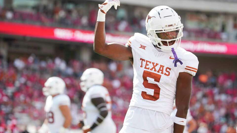 Texas Longhorns wide receiver Adonai Mitchell (5) reacts after scoring a 14-yard touchdown in the first quarter of an NCAA college football game at TDECU Stadium, Saturday, Oct. 21, 2023, in Houston.