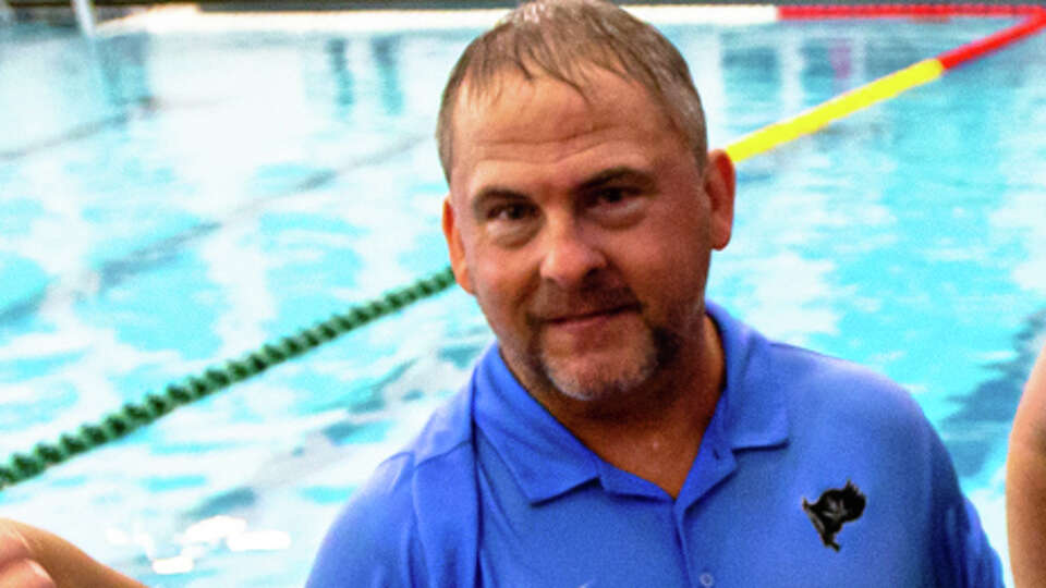 Brazoswood coach Robert Brown talking to his team after a water polo game action during the high school water polo, Region II finals at Lamar High School in Houston, TX, October 22, 2022. Brazoswood defeated Dawson 15-13.