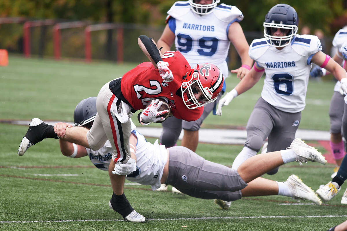 New Canaan High School football survives Wilton in overtime.