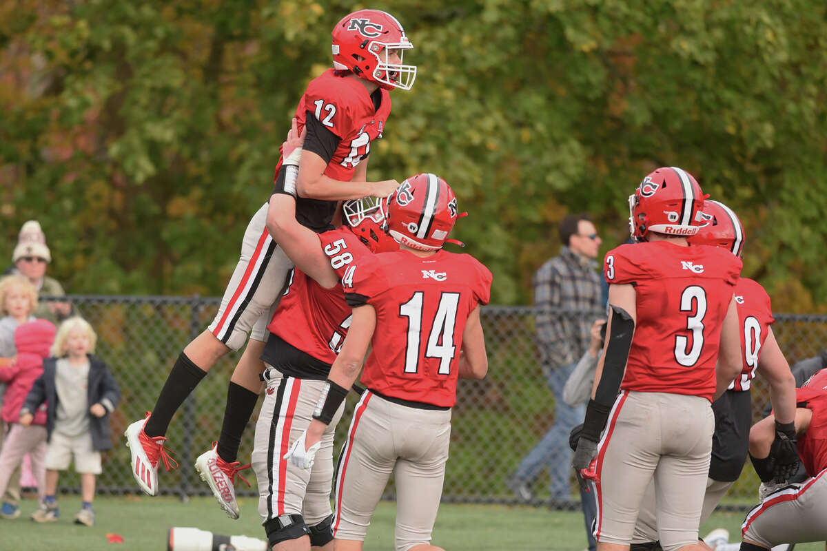 New Canaan High School football survives Wilton in overtime.