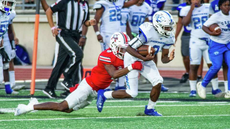 C.E. King's Dionne Sims (3) fights the tackle of Atascocita's Braylon Conley (4) in the first half of a high school football game at George Turner Stadium, Saturday, Oct. 21, 2023 in Humble.