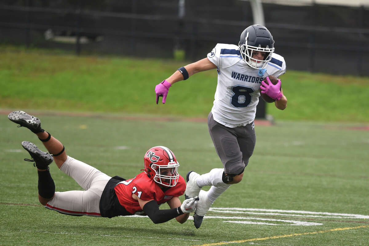 New Canaan High School football survives Wilton in overtime.