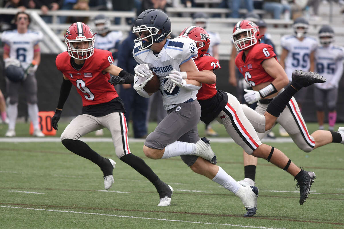 New Canaan High School football survives Wilton in overtime.