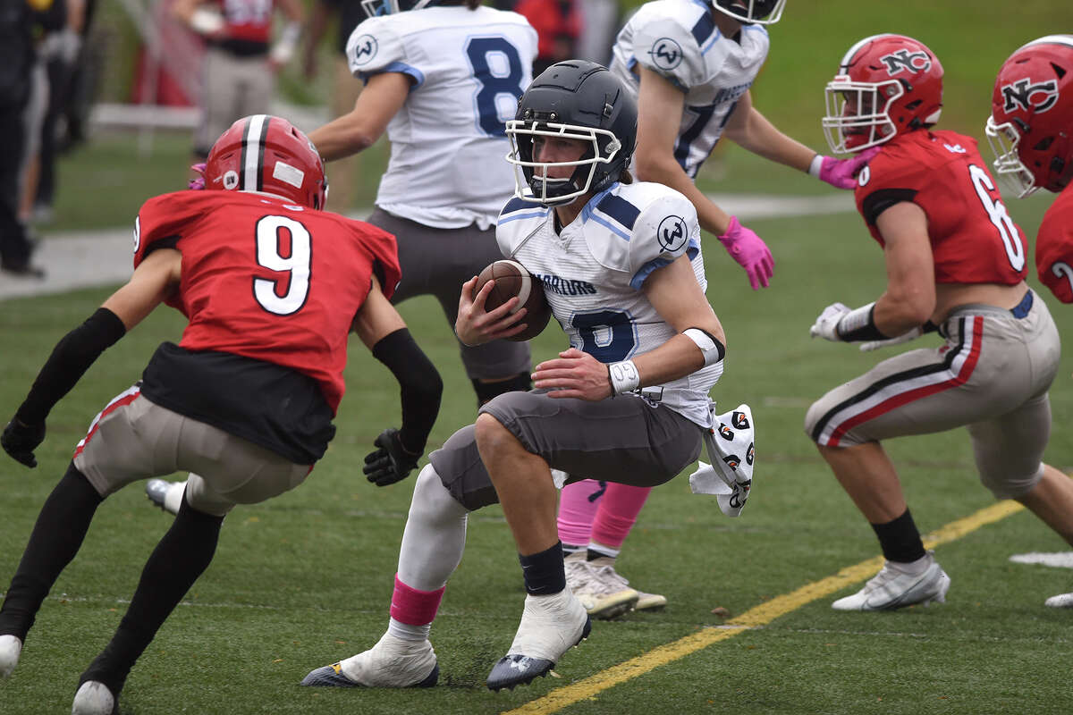New Canaan High School football survives Wilton in overtime.