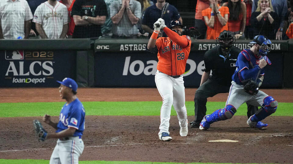 Houston Astros Jon Singleton reacts after striking out against Texas Rangers relief pitcher Jose Leclerc (25) with the bases loaded to end the eighth inning during Game 6 of the American League Championship Series at Minute Maid Park on Sunday, Oct. 22, 2023, in Houston.