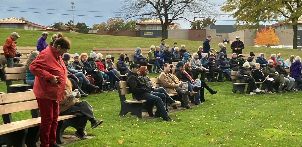 People gather for a candlelight vigil held in Central Park Monday evening to express sympathy for the many lives lost recently in Israel and Gaza and to pray for peace.