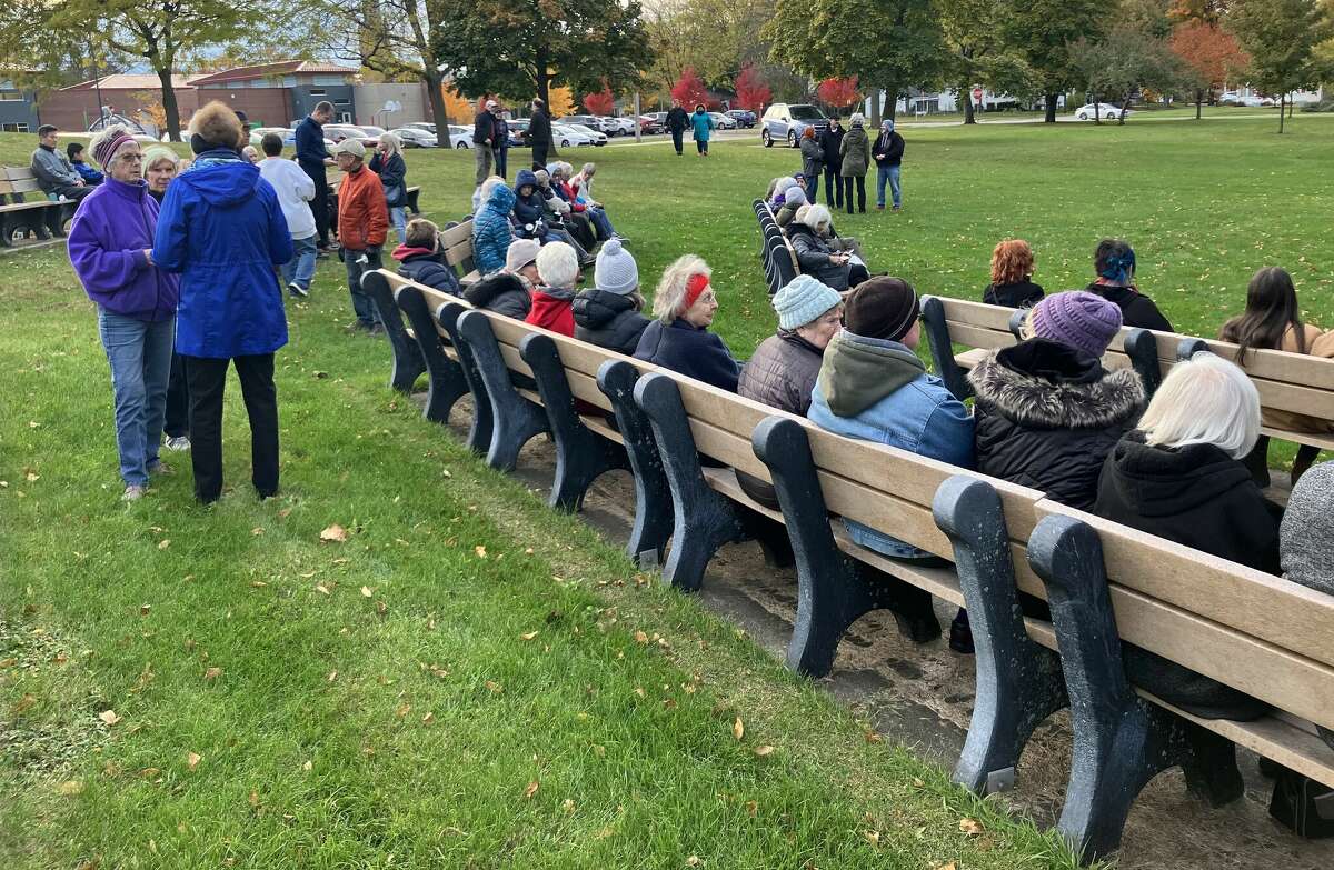 People gather for a candlelight vigil in Central Park Monday evening to express sympathy for the many lives lost recently in Israel and Gaza. . . .