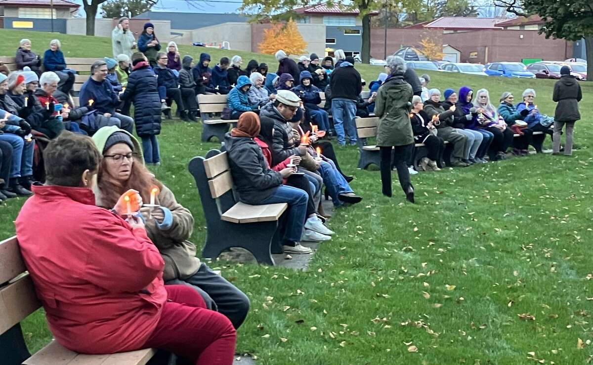 People hold candles Monday evening at a candlelight vigil held in Central Park to express sympathy for the many lives lost recently in Israel and Gaza and to pray for peace.