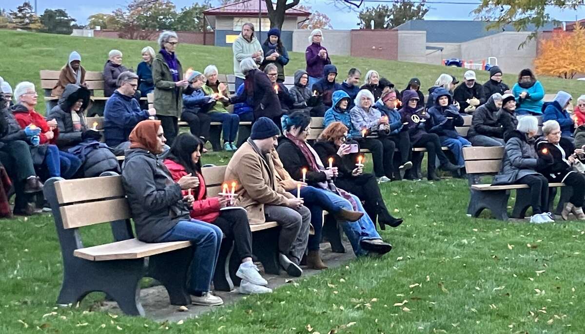People hold candles Monday evening at a candlelight vigil held in Central Park to express sympathy for the many lives lost recently in Israel and Gaza and to pray for peace.