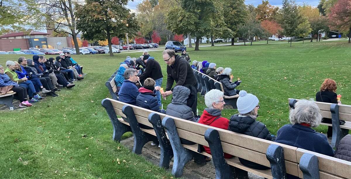 Vigil leaders light other people's candles during a candlelight vigil held in Central Park Monday evening to express sympathy for the many lives lost recently in Israel and Gaza and to pray for peace.