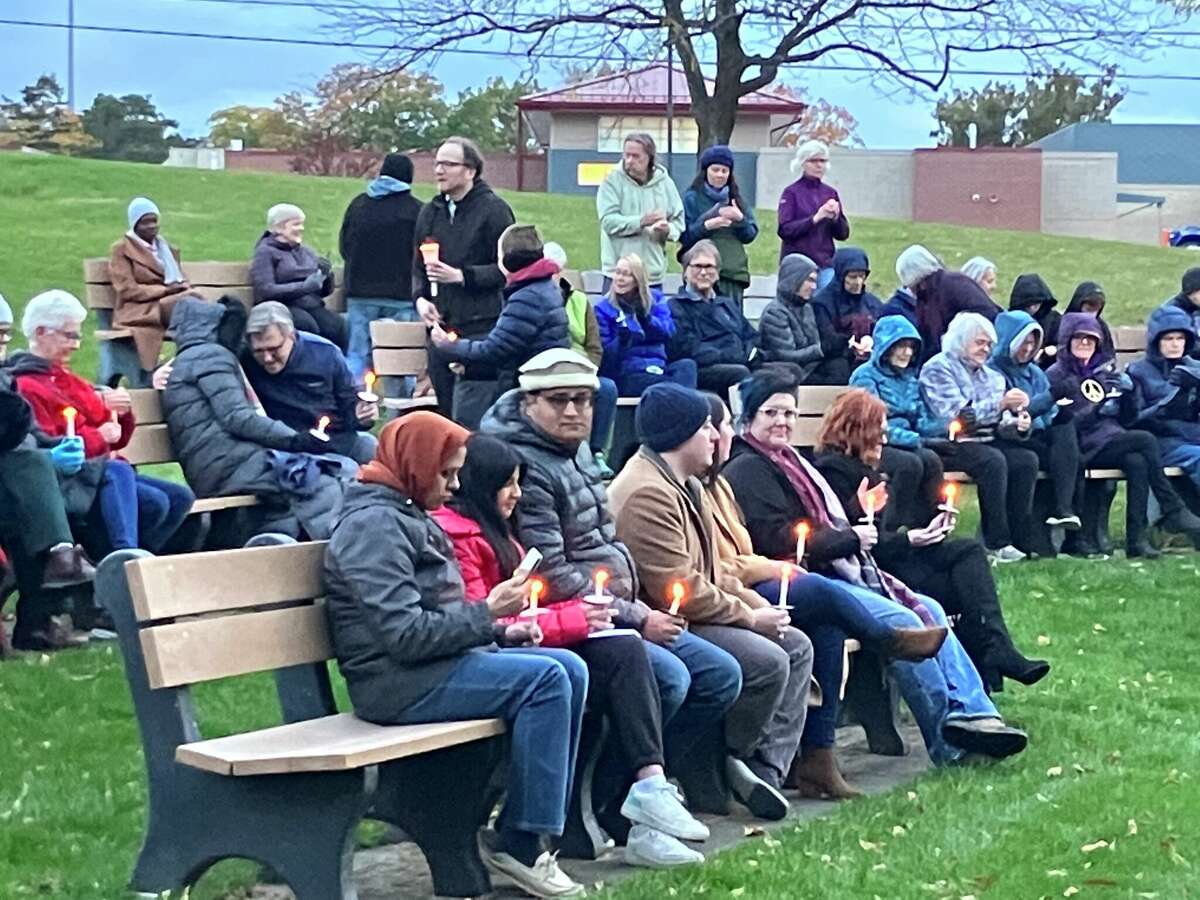 People hold candles Monday evening at a candlelight vigil held in Central Park to express sympathy for the many lives lost recently in Israel and Gaza and to pray for peace.