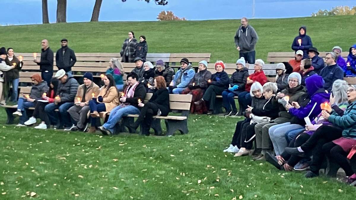 People hold candles Monday evening at a candlelight vigil held in Central Park to express sympathy for the many lives lost recently in Israel and Gaza and to pray for peace.