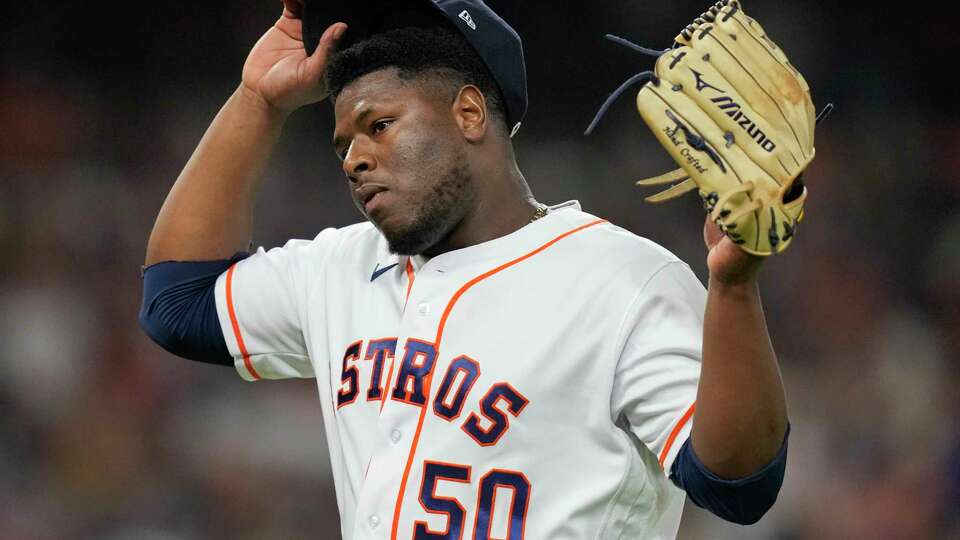 Houston Astros relief pitcher Hector Neris (50) walks to the dugout after getting Texas Rangers Evan Carter to pop out in the fifth inning during Game 7 of the American League Championship Series at Minute Maid Park on Monday, Oct. 23, 2023, in Houston.