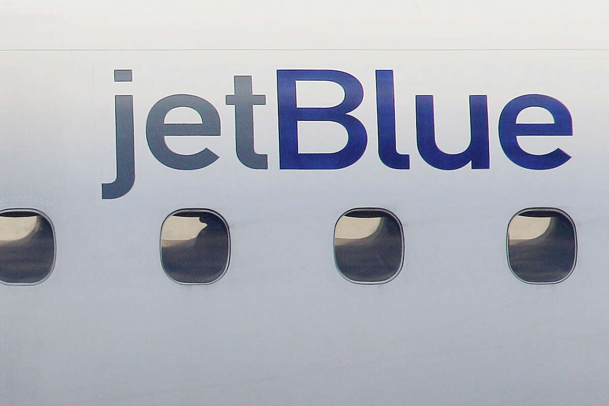 FILE - In this Jan. 20, 2011, file photo, a JetBlue logo is displayed on the side of a jet as it taxis at Boston's Logan International Airport. JetBlue says it will expand its transatlantic flying next spring and summer. The airline said Wednesday, Oct. 25, 2023 it will operate daily flights from New York and Boston to Dublin from March through September, and it plans to fly between New York and Edinburgh from late May through September.