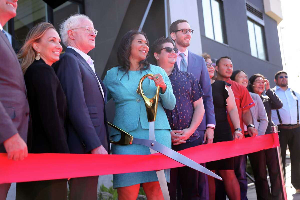 San Francisco Mayor London Breed and state Sen. Scott Wiener, D-San Francisco, join others during a ribbon-cutting ceremony for Kapuso at the Upper Yard, a 131-unit affordable-housing project, in September.