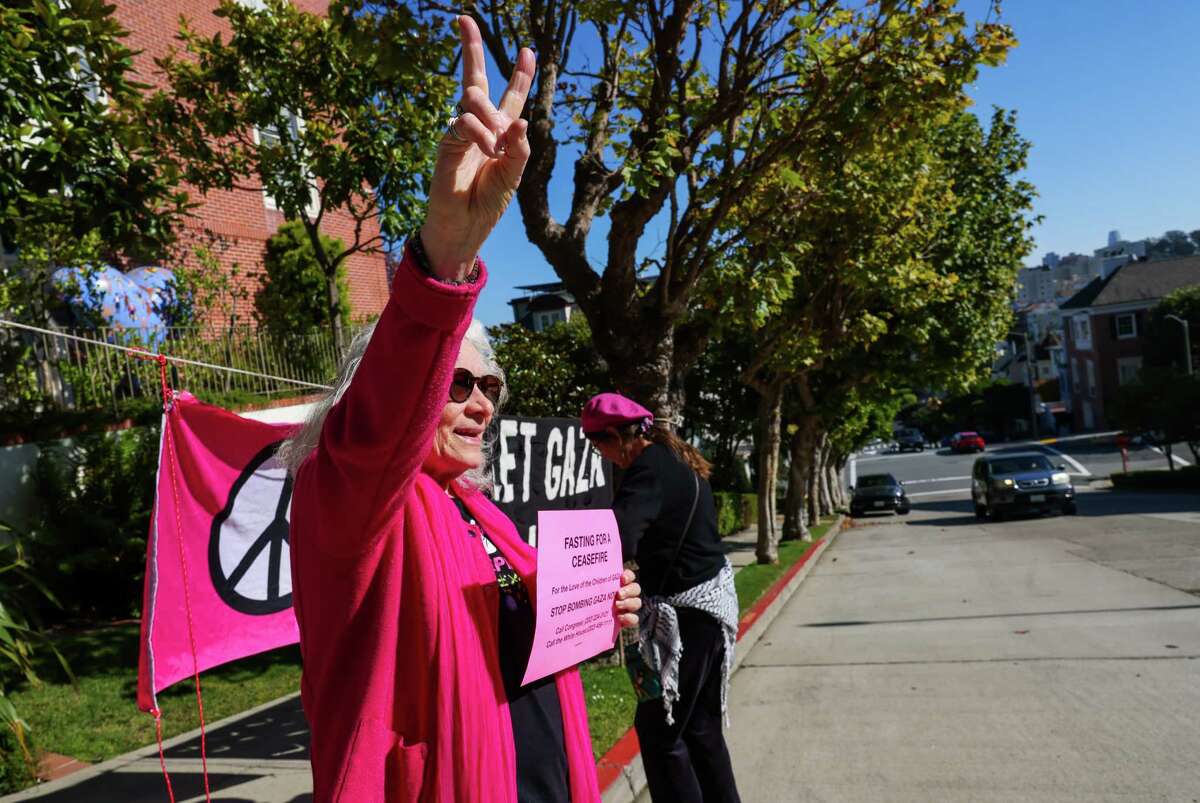 Cynthia Papermaster of Code Pink attends a vigil outside Speaker Emerita Nancy Pelosi’s home in San Francisco calling for a cease-fire in Gaza.