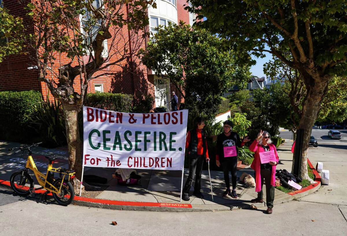 Cynthia Papermaster of Code Pink attends a vigil outside Speaker Emerita Nancy Pelosi’s home in San Francisco.  