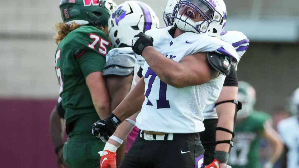 Willis defensive lineman Day'Jon Moore (71) reacts after sacking The Woodlands backup quarterback Patrick Miller during the fourth quarter of a District 13-6A high school football game at Woodforest Bank Stadium, Saturday, Oct. 28, 2023, in Shenandoah.