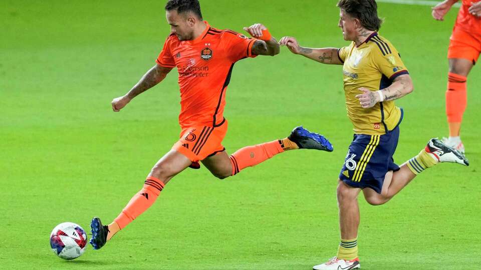 Houston Dynamo midfielder Artur (6) takes the ball past Real Salt Lake midfielder Diego Luna (26) during the second half of an MLS playoff soccer match on Sunday, Oct. 29, 2023 in Houston. The Dynamo too the first game 2-1, in the best-of-three series.