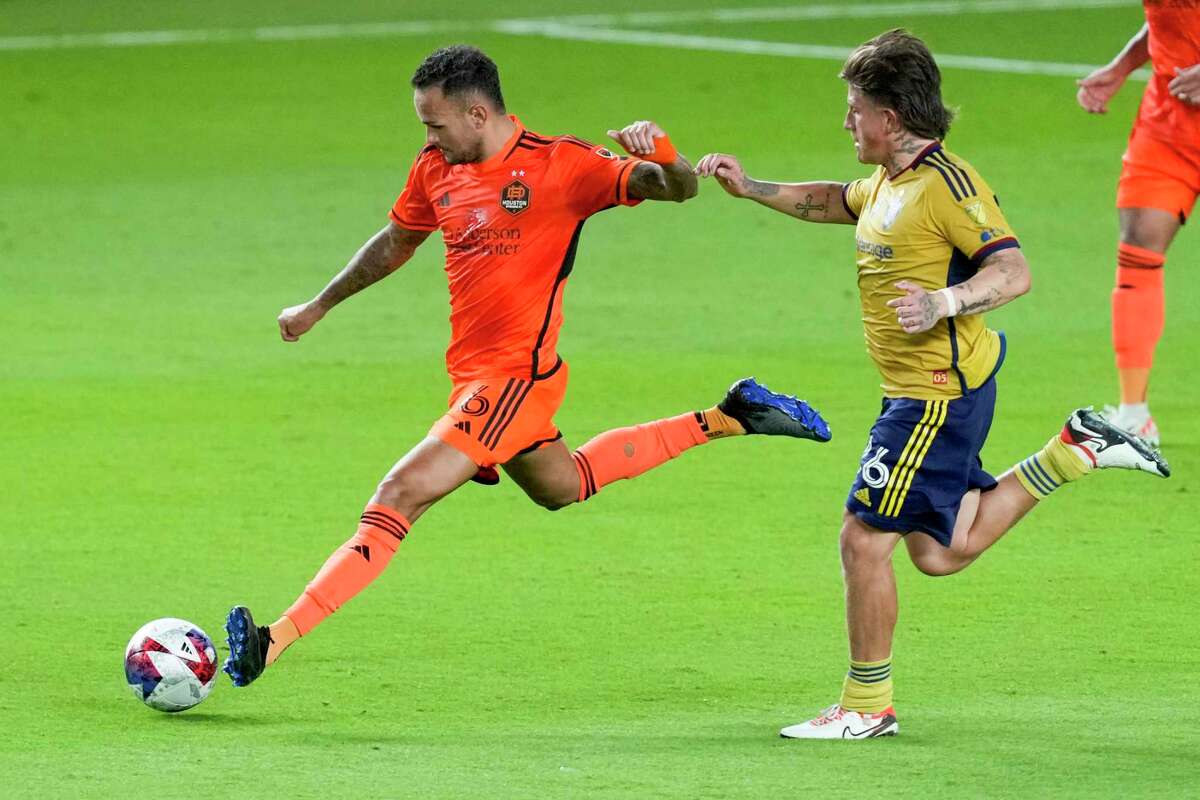 Houston Dynamo midfielder Artur (6) takes the ball past Real Salt Lake midfielder Diego Luna (26) during the second half of an MLS playoff soccer match on Sunday, Oct. 29, 2023 in Houston. The Dynamo too the first game 2-1, in the best-of-three series.