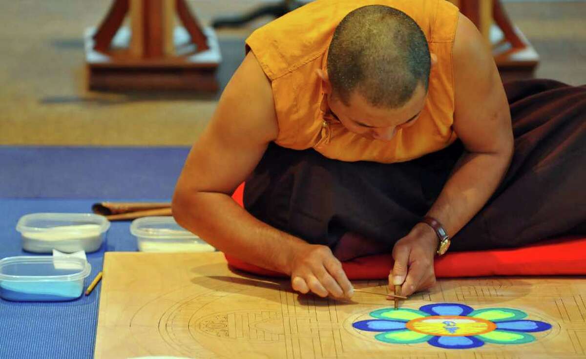 Lama Karma Chopal makes a mandala at the College of Saint Rose Hubbard Interfaith Sanctuary in Albany, NY on Monday October 25, 2010. The mandala will be completed Friday.( Philip Kamrass / Times Union )