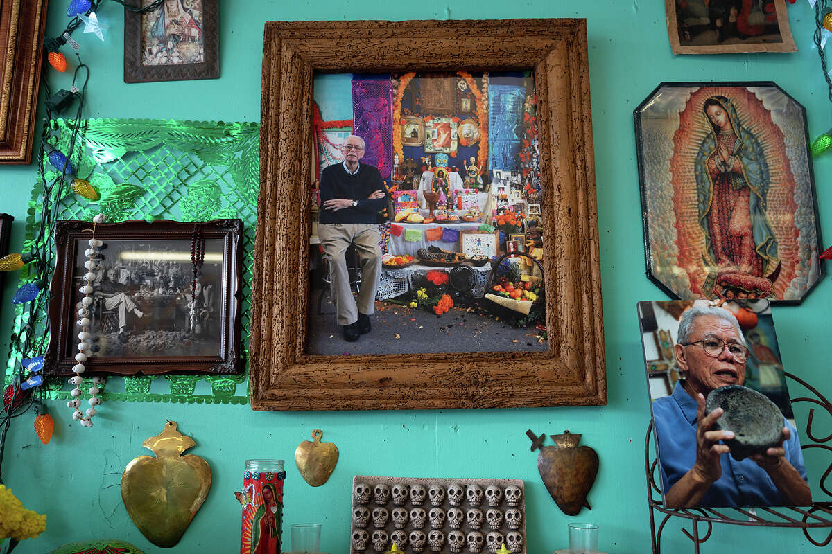 Macario Ramirez is seen in a photo next to an altar at Casa Ramirez, the Mexican folk art store he founded in the Heights in Houston, TX on Friday October 27, 2023. 