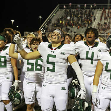 Members of the Reagan football team sing the school song after the UIL football game against Brandeis Friday, Nov. 3, 2023, at Farris Stadium in San Antonio, Texas.