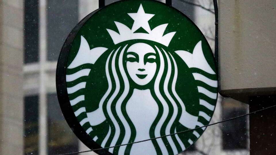 FILE - The Starbucks logo is seen on a shop, March 14, 2017, in downtown Pittsburgh. Starbucks is increasing pay and benefits for most of its U.S. hourly workers after ending its fiscal year with record sales. But the company said Monday, Nov. 6, 2023, that unionized workers won't be eligible for some of those perks, a sign of the continuing tension between the Seattle coffee giant and the union trying to organize its U.S. stores.