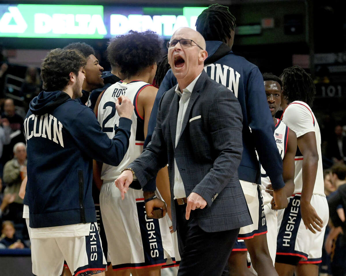 UW coach Dan Hurley celebrates the first half at Gampel Pavilion in Storrs on November 6, 2023.