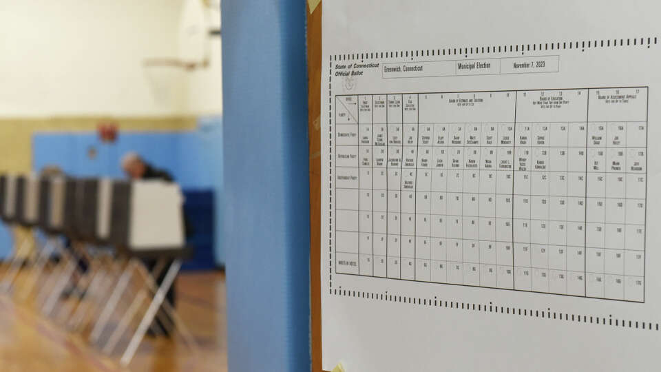 A sample ballot is displayed at the District 6 polling center at Old Greenwich School in Old Greenwich, Conn. Tuesday, Nov. 7, 2023.