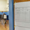 A sample ballot is displayed at the District 6 polling center at Old Greenwich School in Old Greenwich, Conn. Tuesday, Nov. 7, 2023.