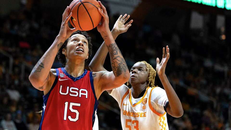 Team USA center Brittney Griner (15) looks to shoot past Tennessee forward Jillian Hollingshead (53) during the second half of an NCAA college basketball exhibition game, Sunday, Nov. 5, 2023, in Knoxville, Tenn. (AP Photo/Wade Payne)