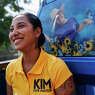 Uvalde mayoral candidate Kimberly Mata-Rubio rides in the back of her family’s pick up truck after walking in Uvalde’s Labor Day Weekend parade on Saturday, Sept. 2, 2023, in Uvalde, Texas. The truck wrapped with pictures of her daughter Lexi Rubio, one of the 19 children killed in the Robb Elementary massacre on May 24, 2022.