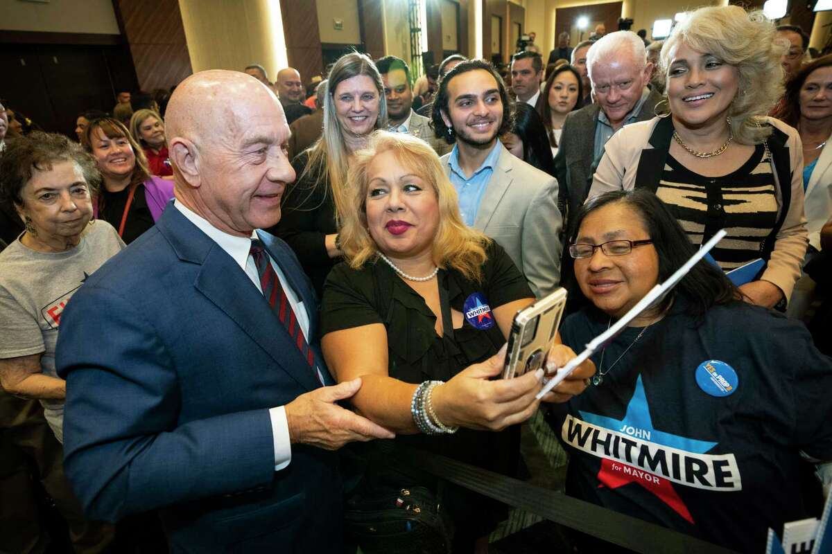 Mayoral candidate State Sen. John Whitmire takes photos with his supporters during an election watch party on Tuesday, Nov. 7, 2023 in Houston.