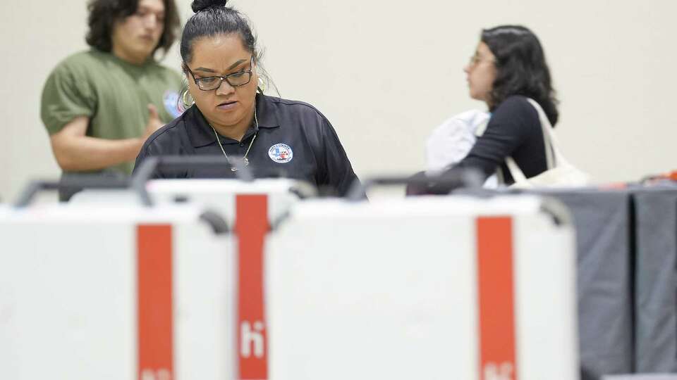 Harris County election workers accept paper ballots and voting machines at NRG Stadium on Tuesday, Nov. 7, 2023 in Houston.