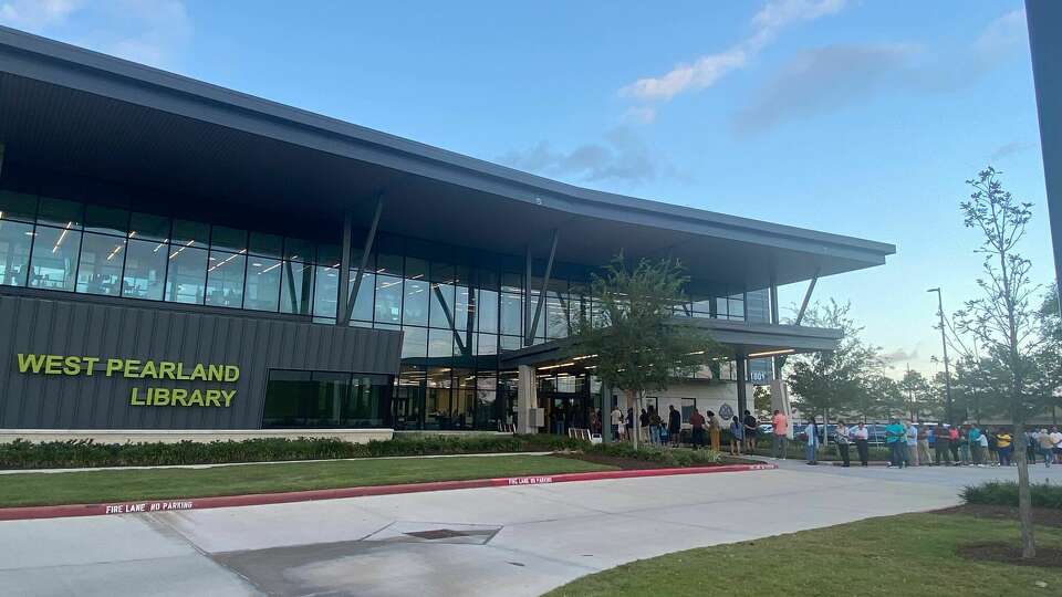 A line of voters wrap around the West Pearland Library on Tuesday at around 5 p.m. 