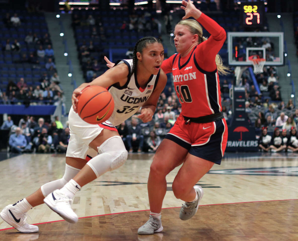 UConn's Azzi Fudd (35) drives to the basket as Dayton's Ivy Wolf (10) defends during women's college basketball action at the XL Center Arena in Hartford, Conn., on Wednesday November 8, 2023.