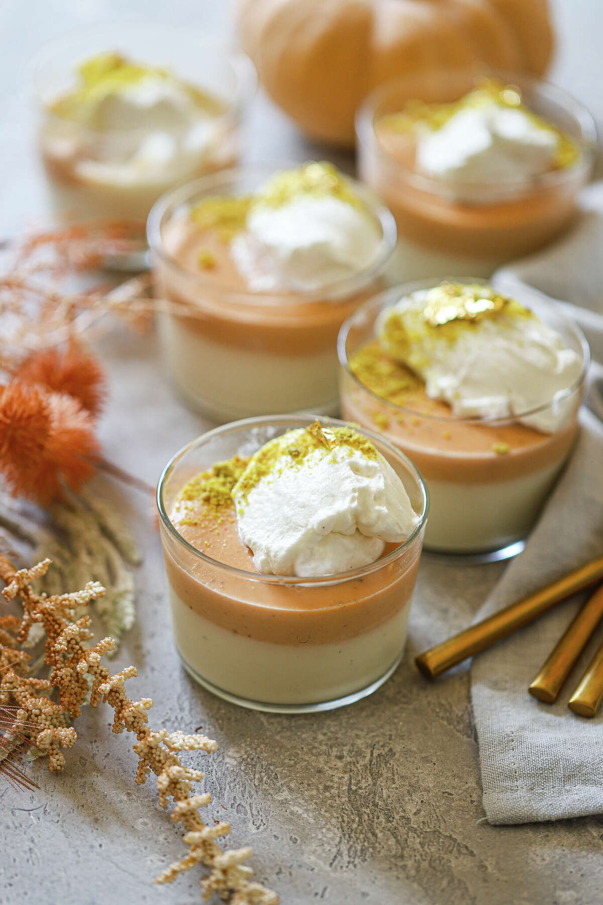 This pumpkin pudding is spiced with chai masala and garnished with whipped cream and pistachios.