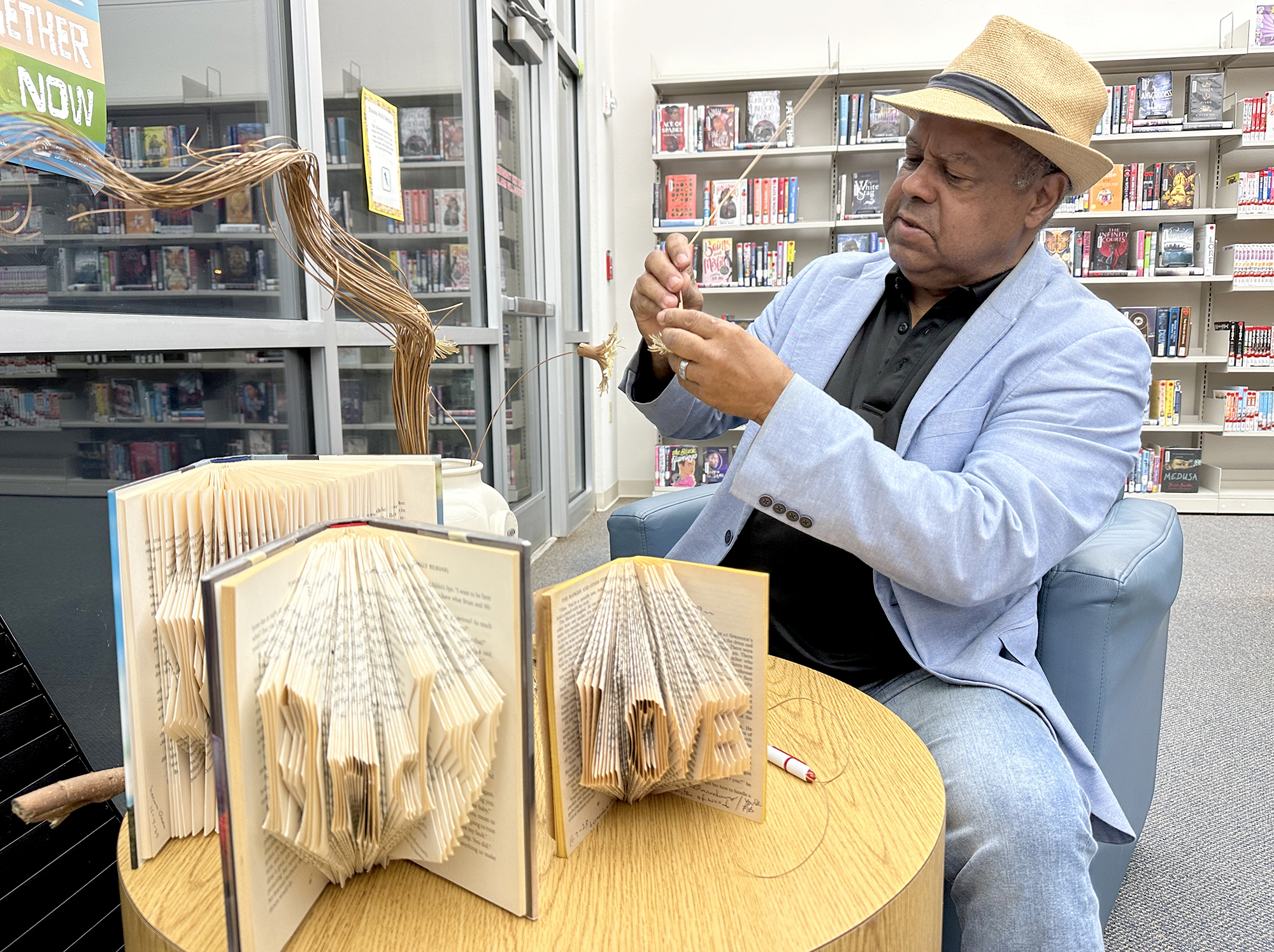 Veteran Herman Davis known for wood carvings turns to book art