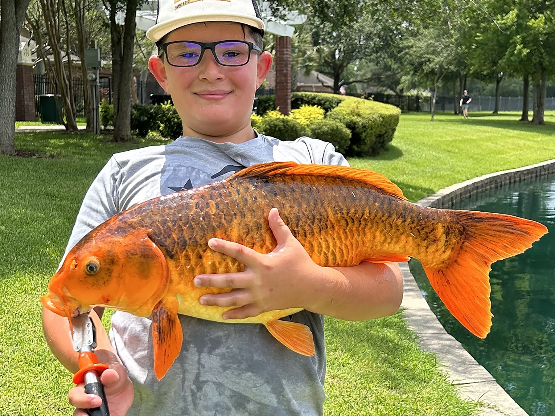 Texas 6th grader hauls in a massive 15-pound koi fish