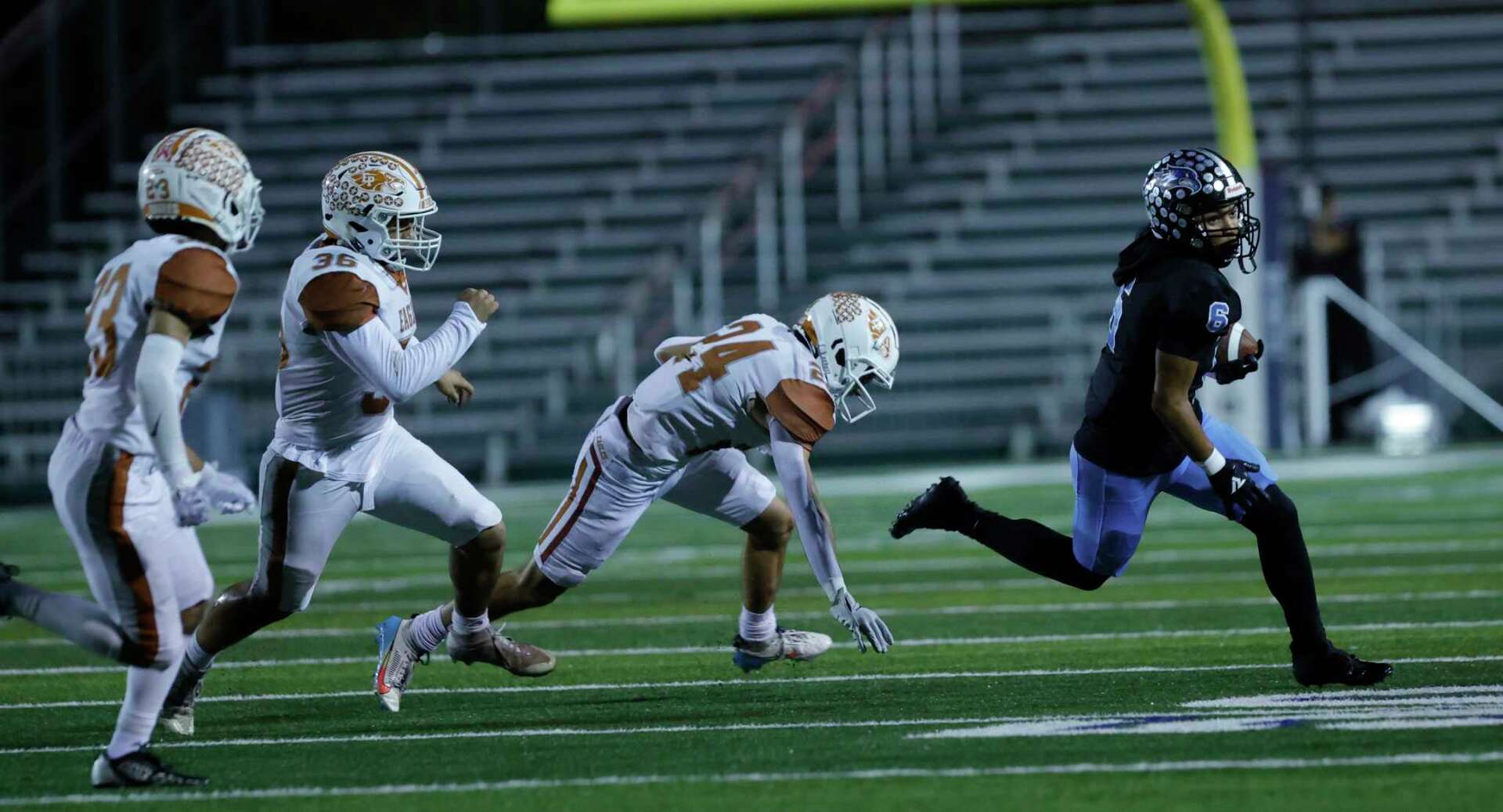 Harlan football holds off Eagle Pass in bi-district playoff