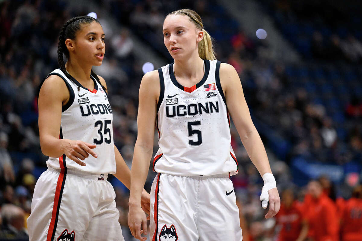 UConn guard Azzi Fudd (35) talks with UConn guard Paige Bueckers (5) in the second half of an NCAA college basketball game, Wednesday, Nov. 8, 2023, in Hartford, Conn. (AP Photo/Jessica Hill)