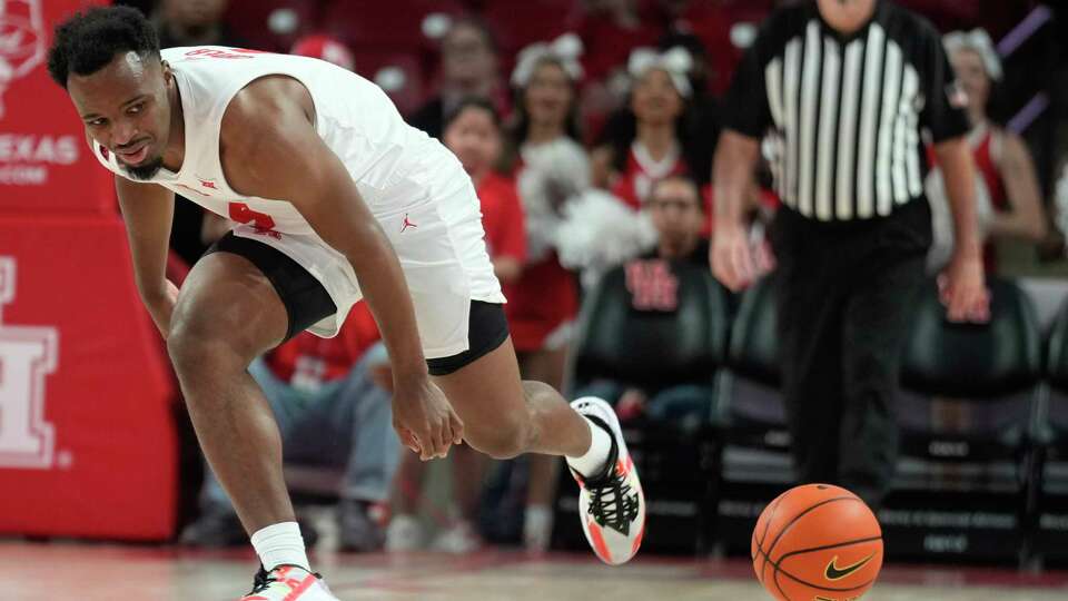 Houston guard LJ Cryer (4) fails to contain a loose ball during the first half of an NCAA college basketball game at the Fertitta Center, Saturday, Nov. 11, 2023, in Houston.