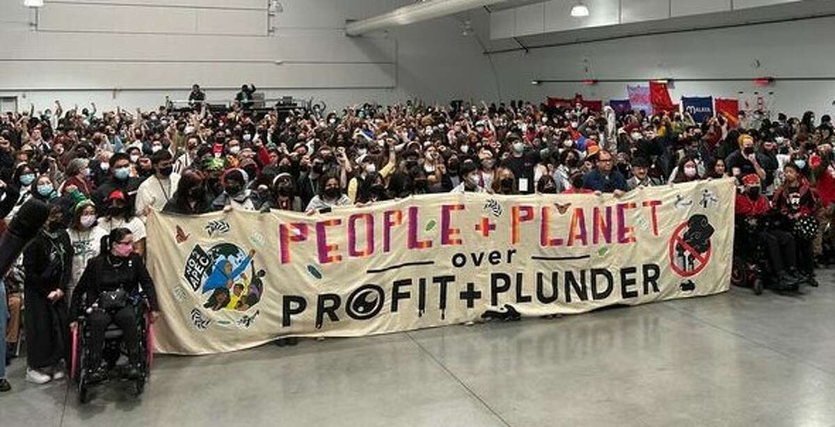 A crowd listens as speakers present an alternative to the Asia-Pacific Economic Cooperation conference during Saturday’s No to APEC summit at San Francisco State University.