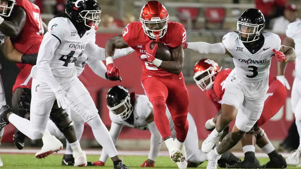 Houston Cougars running back Parker Jenkins (23) runs for a 16-yard gain during the first half of a NCAA college football game at TDECU Stadium, Saturday, Nov. 11, 2023, in Houston.