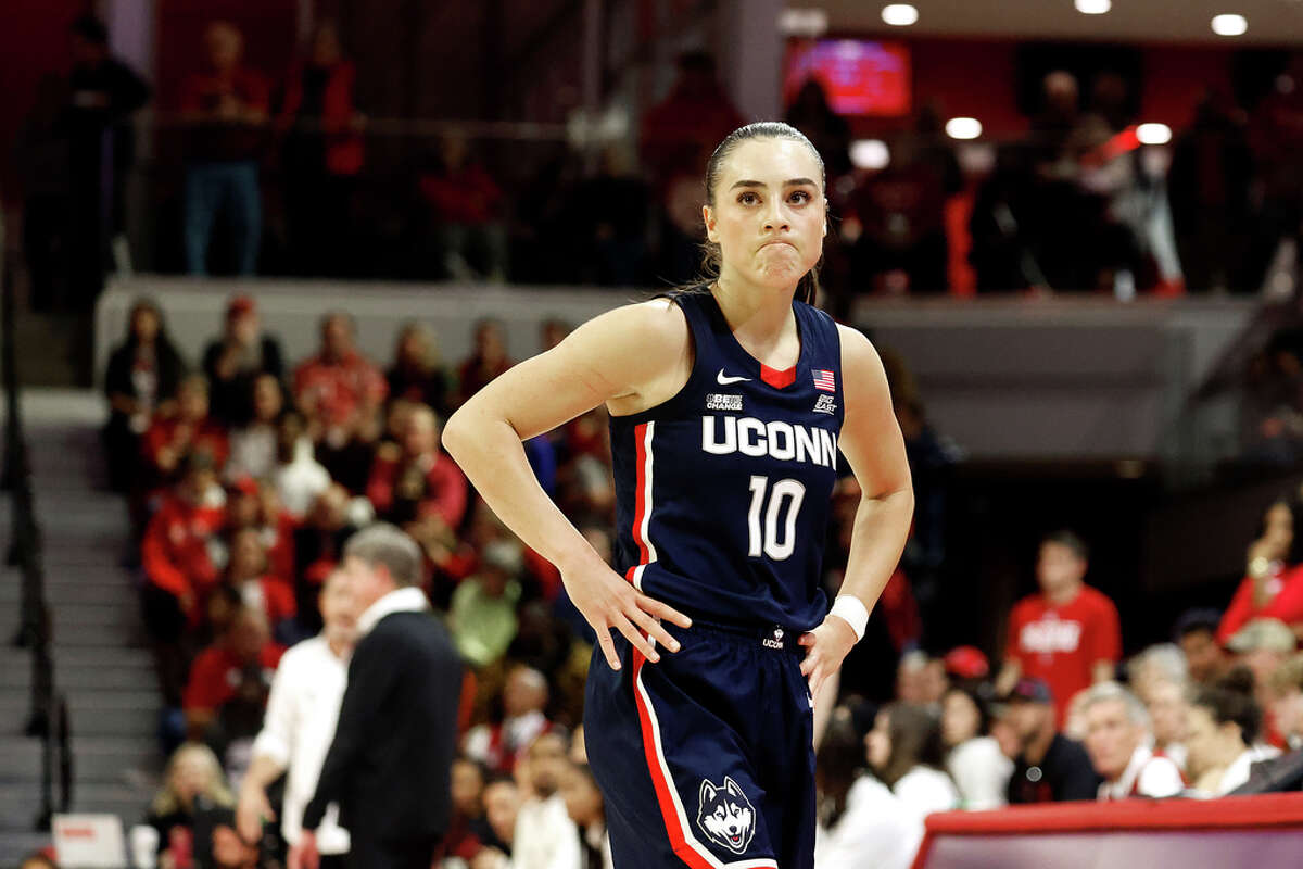 UConn's Nika Muhl (10) reacts during the second half of an NCAA college basketball game against North Carolina State, Sunday, Nov. 12, 2023, in Raleigh, N.C. (AP Photo/Karl B. DeBlaker)