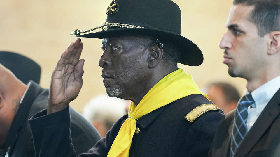 A Buffalo Solider salutes during the singing of the National Anthem before an event recognizing the legacy of the soldiers from the 3rd Battalion, 24th Infantry Regiment, at Buffalo Soldiers Museum on Monday, Nov. 13, 2023 in Houston.