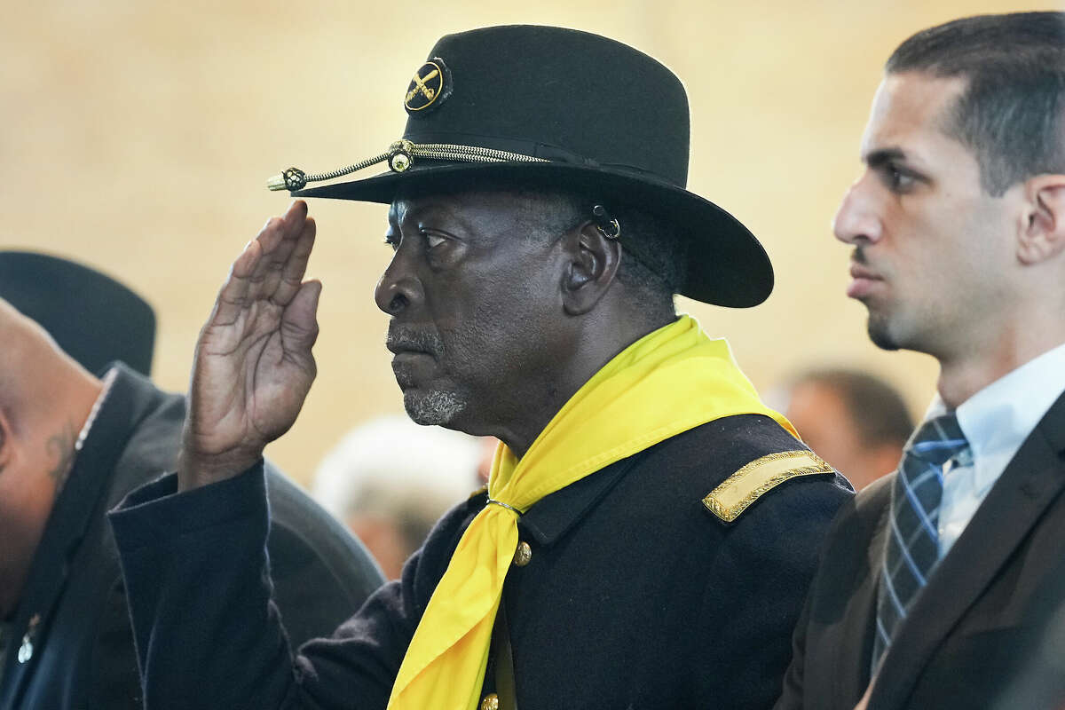 A Buffalo Solider salutes during the singing of the National Anthem before an event recognizing the legacy of the soldiers from the 3rd Battalion, 24th Infantry Regiment, at Buffalo Soldiers Museum on Monday, Nov. 13, 2023 in Houston.